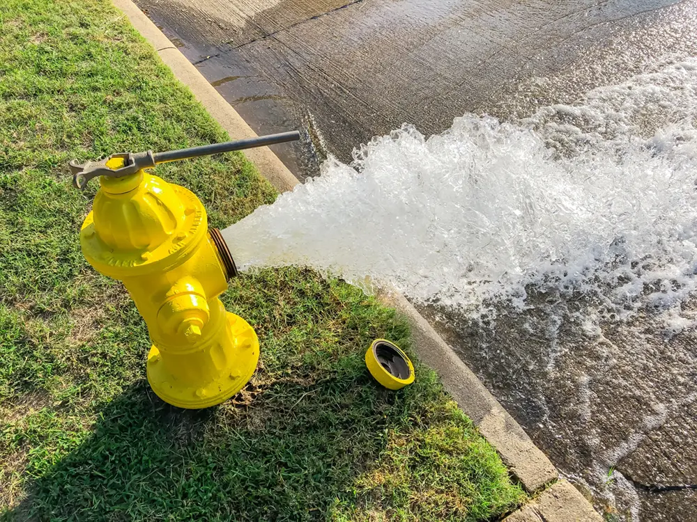 Flushing fire hydrants in traditional water systems can waste excess water while maintaining chlorine levels.